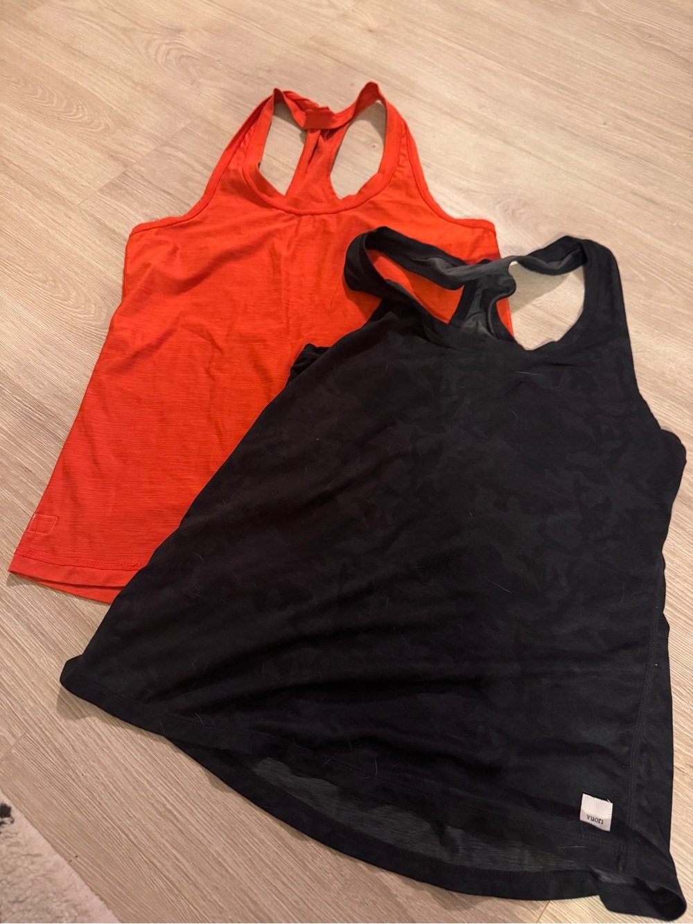 Vuori Racerback Tank Tops in Black & Red